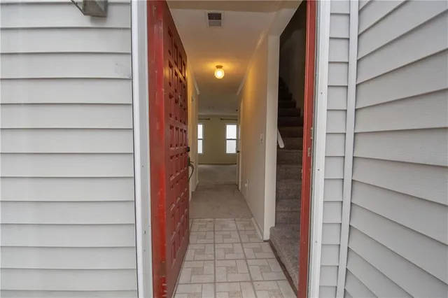 a bathroom with a toilet a sink a vanity and mirror