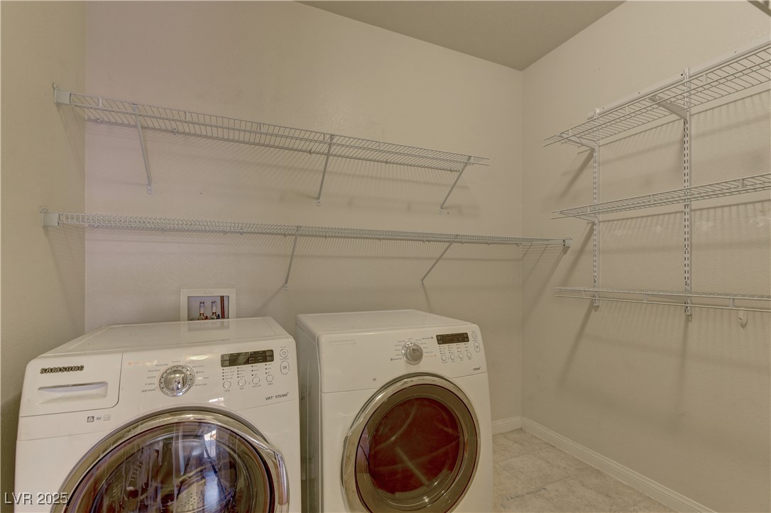 972 Rue Grand Paradis Lane Henderson, NV 89011 - Photo 25 of 32 Laundry room with baseboards and washing machine and clothes dryer