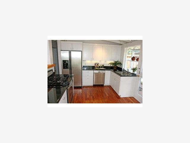 2416 Laura Lane Mountain View, CA 94043 - Photo 3 of 9 a kitchen with sink and refrigerator