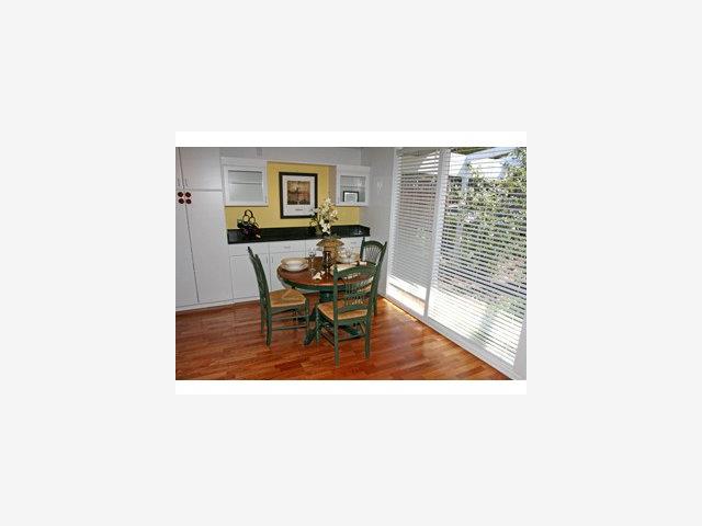 2416 Laura Lane Mountain View, CA 94043 - Photo 4 of 9 a living room with furniture and a floor to ceiling window