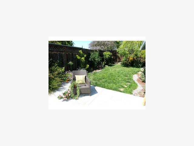 2416 Laura Lane Mountain View, CA 94043 - Photo 9 of 9 a picture of a bench in a garden