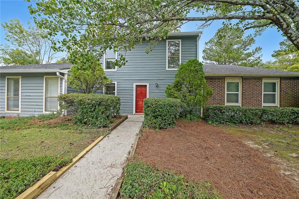 254 Mateo Walk Lawrenceville, GA 30046 - Photo 1 of 1 front view of a house with a yard