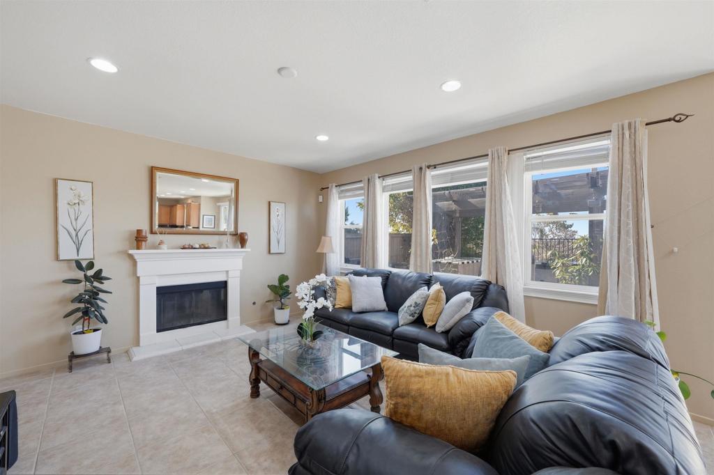 2784 Rambling Vista Road Chula Vista, CA 91915 - Photo 15 of 42 a living room with furniture fireplace and window