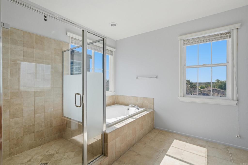 2784 Rambling Vista Road Chula Vista, CA 91915 - Photo 21 of 42 a bathroom with a bathtub and a shower