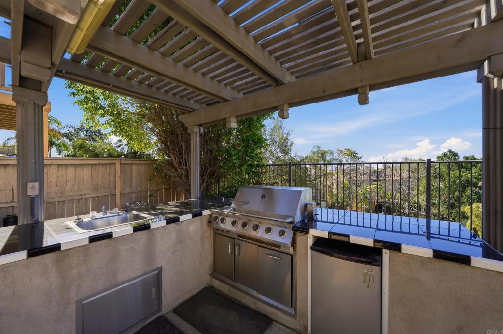 2784 Rambling Vista Road Chula Vista, CA 91915 - Photo 26 of 42 a view of a patio with a table and chairs