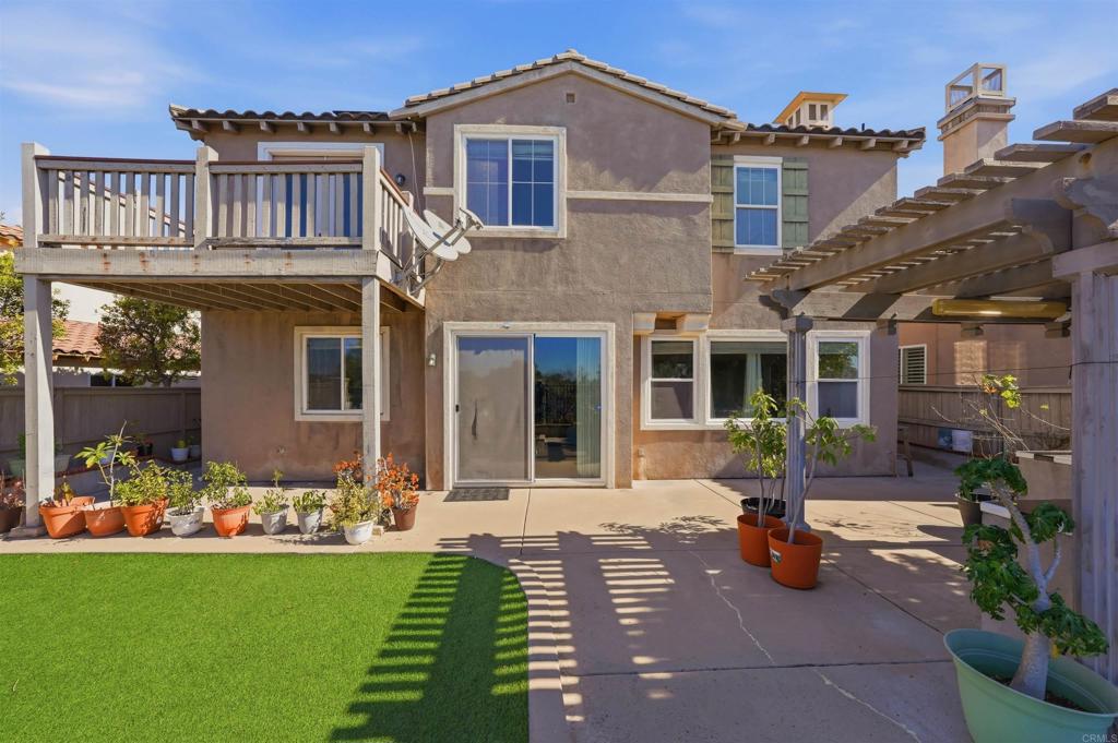 2784 Rambling Vista Road Chula Vista, CA 91915 - Photo 42 of 42 a front view of a house with garden