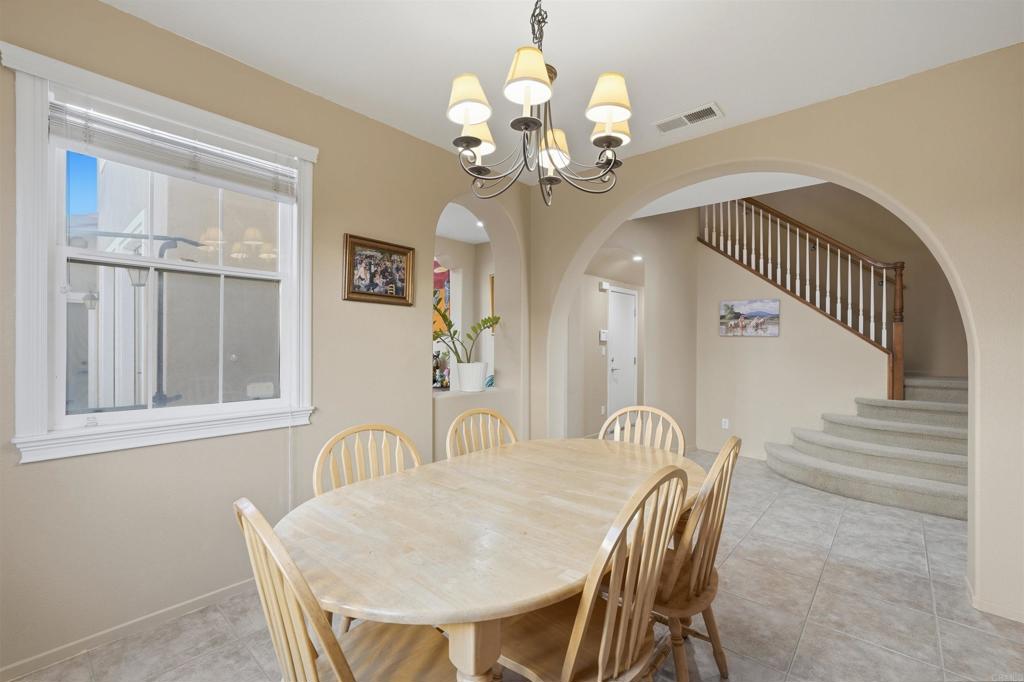 2784 Rambling Vista Road Chula Vista, CA 91915 - Photo 9 of 42 a view of a dining room with furniture and chandelier