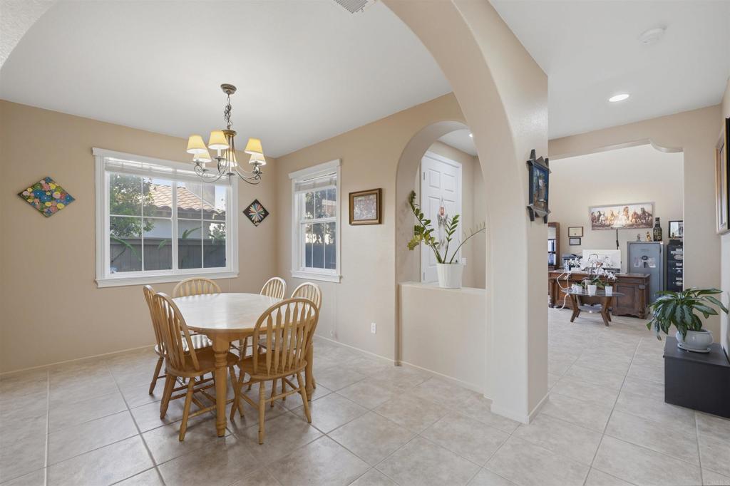 2784 Rambling Vista Road Chula Vista, CA 91915 - Photo 10 of 42 a view of a dining room with furniture and chandelier