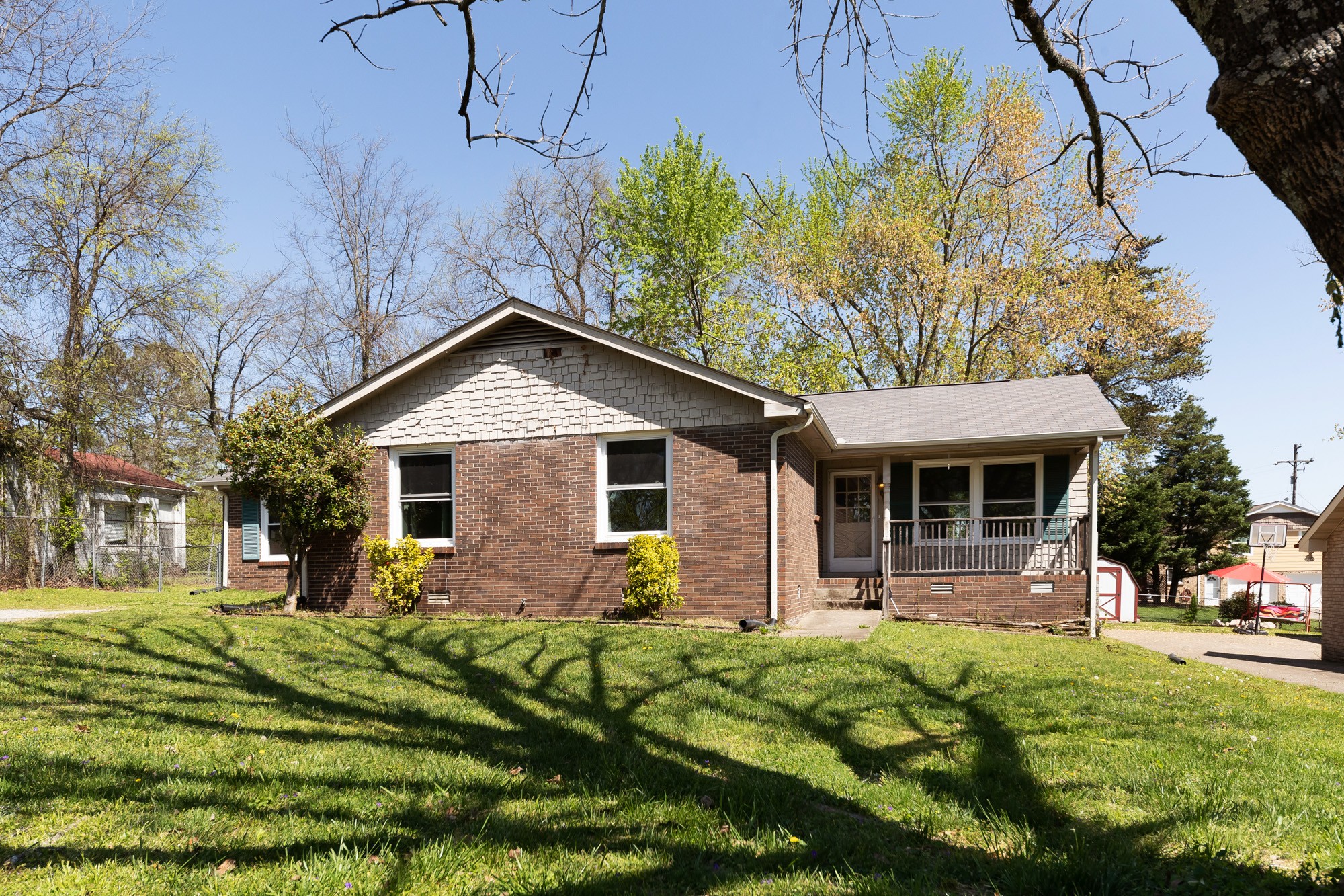 2906 Anderson Road Nashville, TN 37217 - Photo 1 of 35 a front view of a house with garden