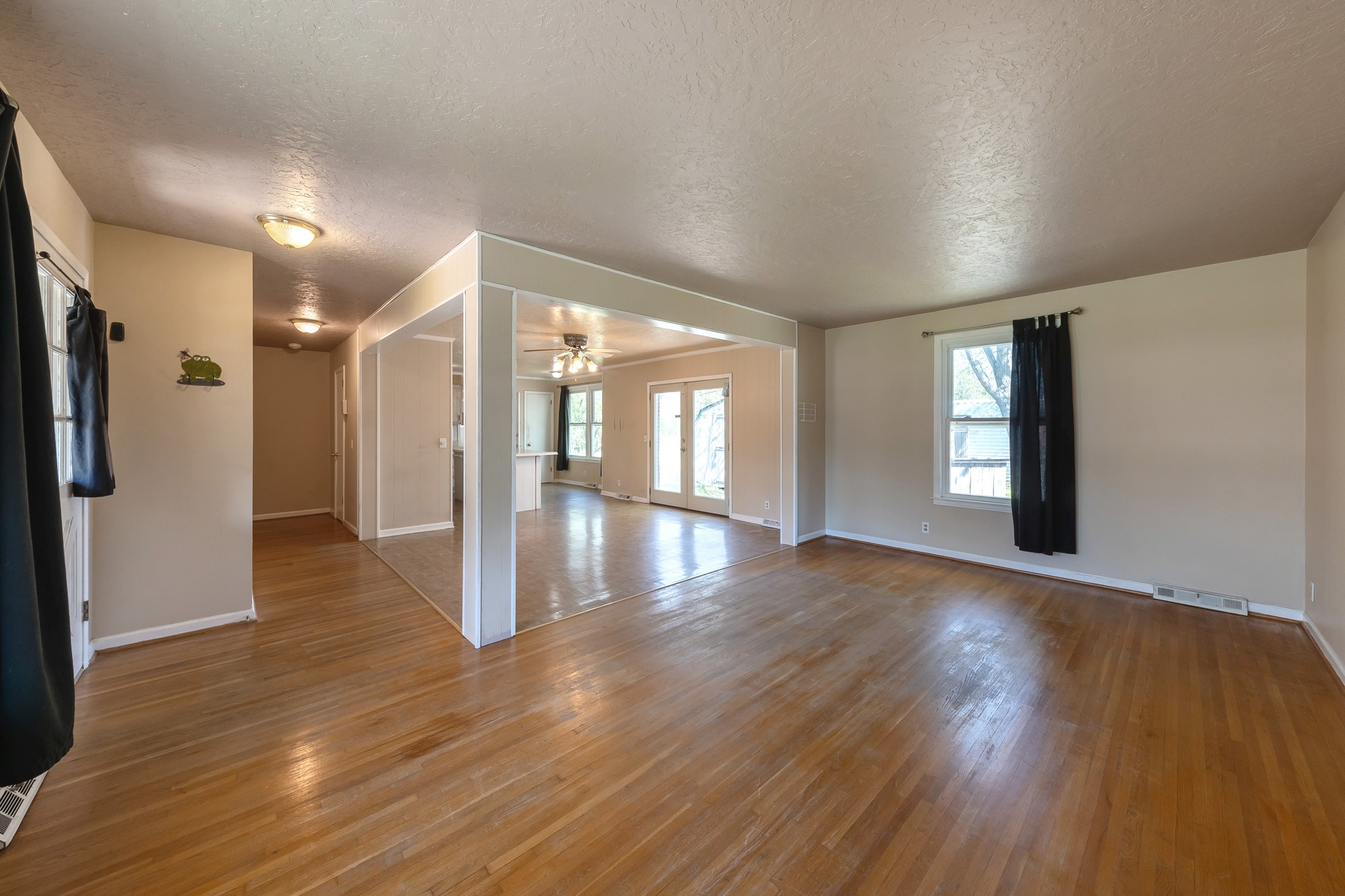 2906 Anderson Road Nashville, TN 37217 - Photo 8 of 35 a view of an empty room with wooden floor and a window
