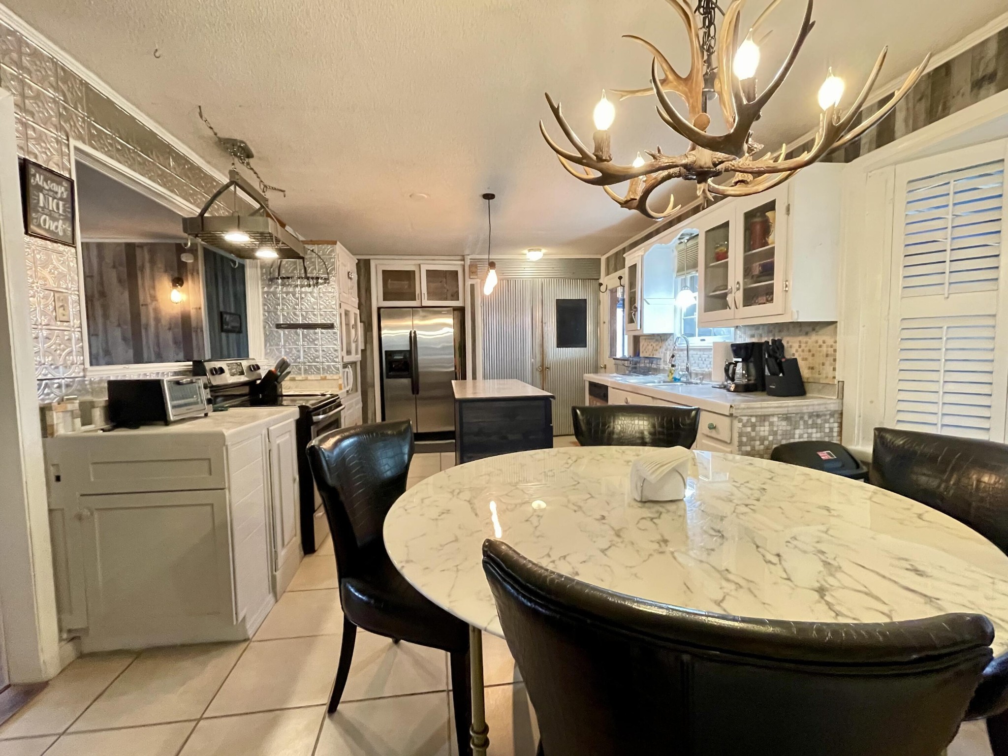 1522 Turkey Creek Road Tellico Plains, TN 37385 - Photo 16 of 34 a large kitchen with a table and chairs