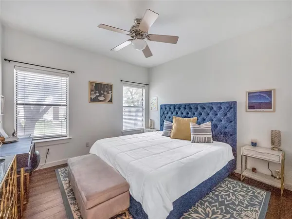 a bedroom with a large bed and a window