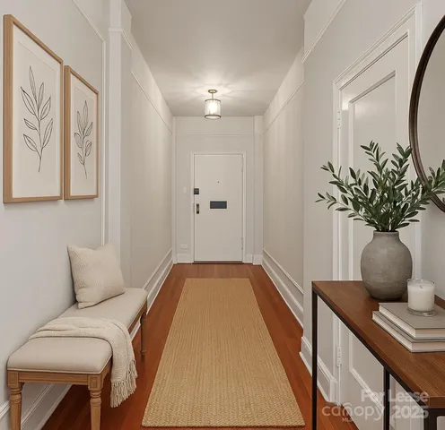 a bedroom with furniture and a potted plant