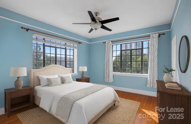 a bedroom with a large bed and a window