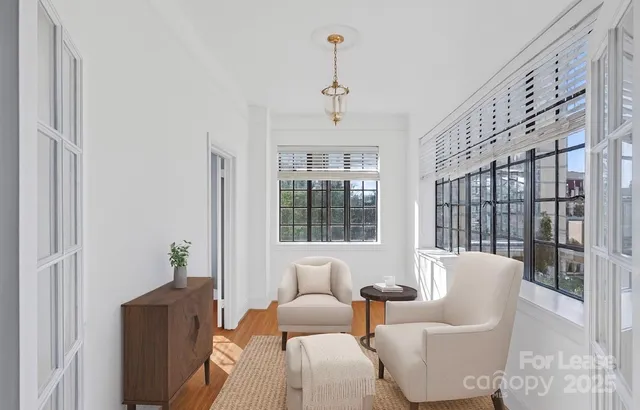 a living room with furniture and windows