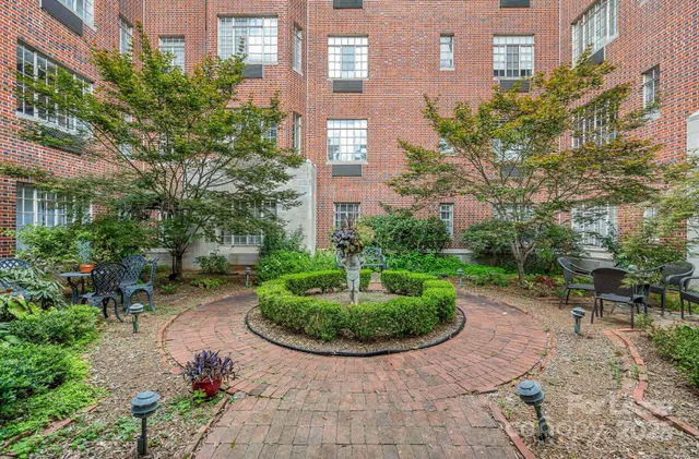a view of a building with a garden