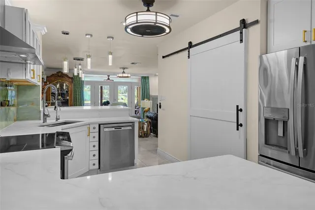 a kitchen with a refrigerator and countertop