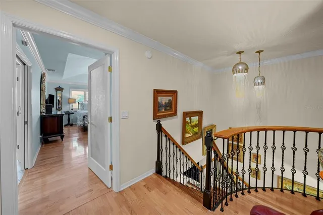 a view of a hallway view with staircase