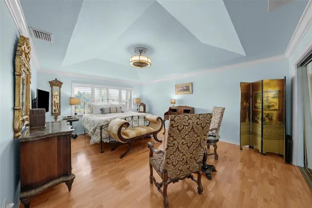 a bedroom with furniture and a window