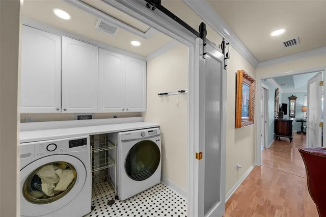 a view of a hallway with washer and dryer