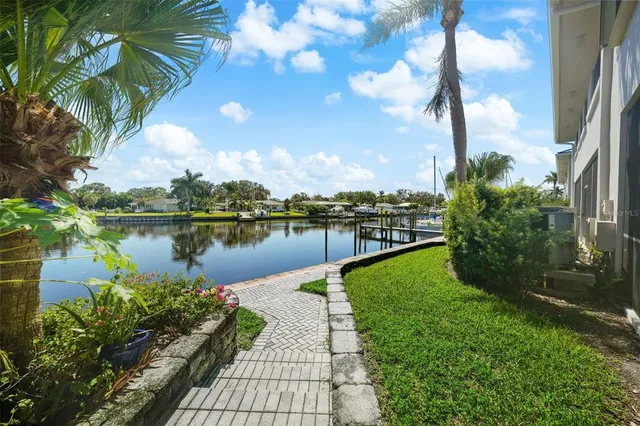 a view of a lake with a big yard