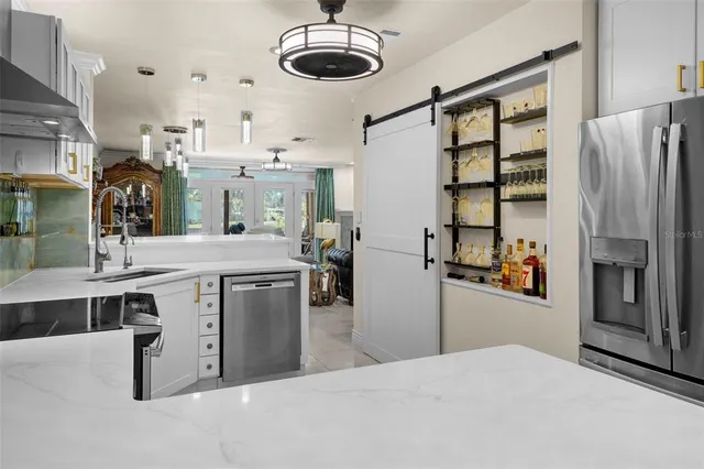a kitchen with a refrigerator and countertop