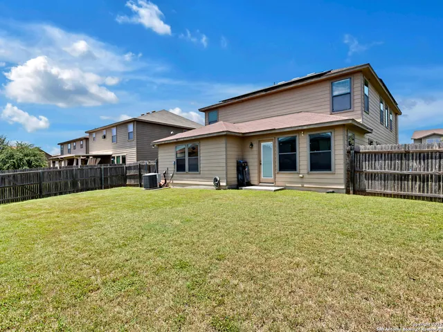 a front view of a house with a garden and porch