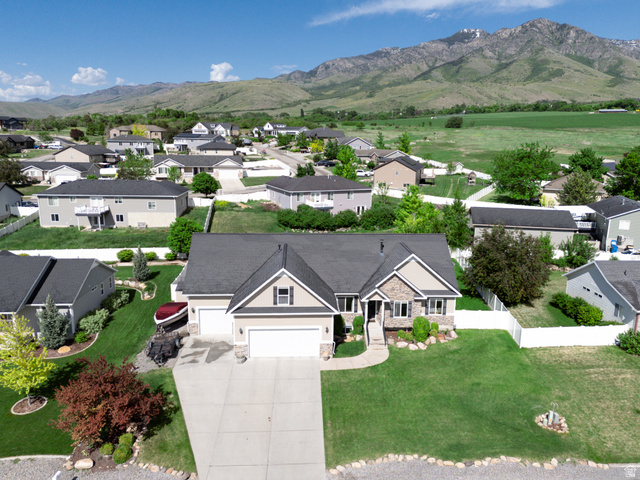 580 Cherry Ridge Lane Richmond, UT 84333 - Photo 51 of 53 Aerial perspective of suburban area with a mountain backdrop