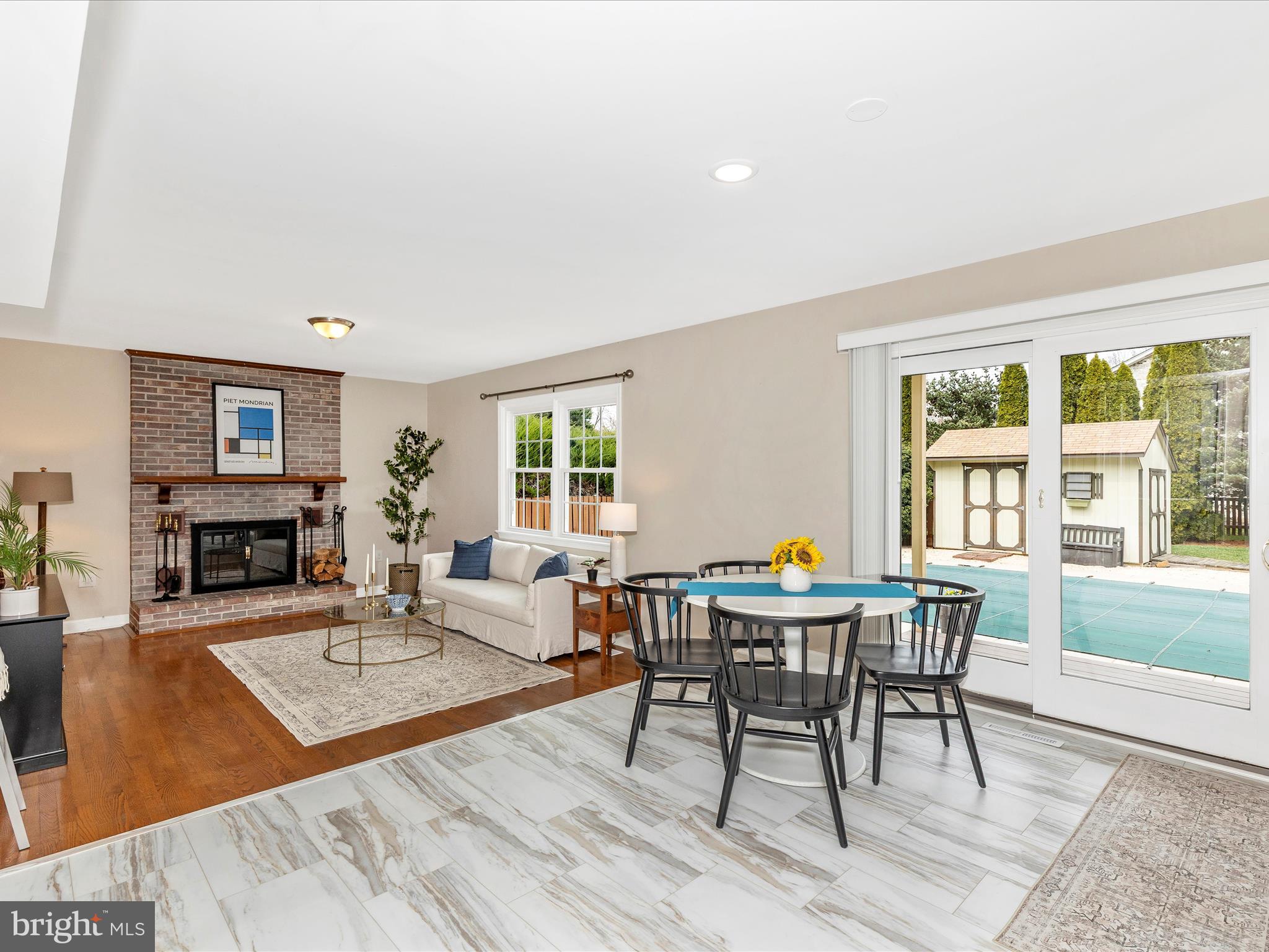 7094 Autumn Leaf Lane Frederick, MD 21702 - Photo 43 of 43 a living room with furniture a fireplace and a table