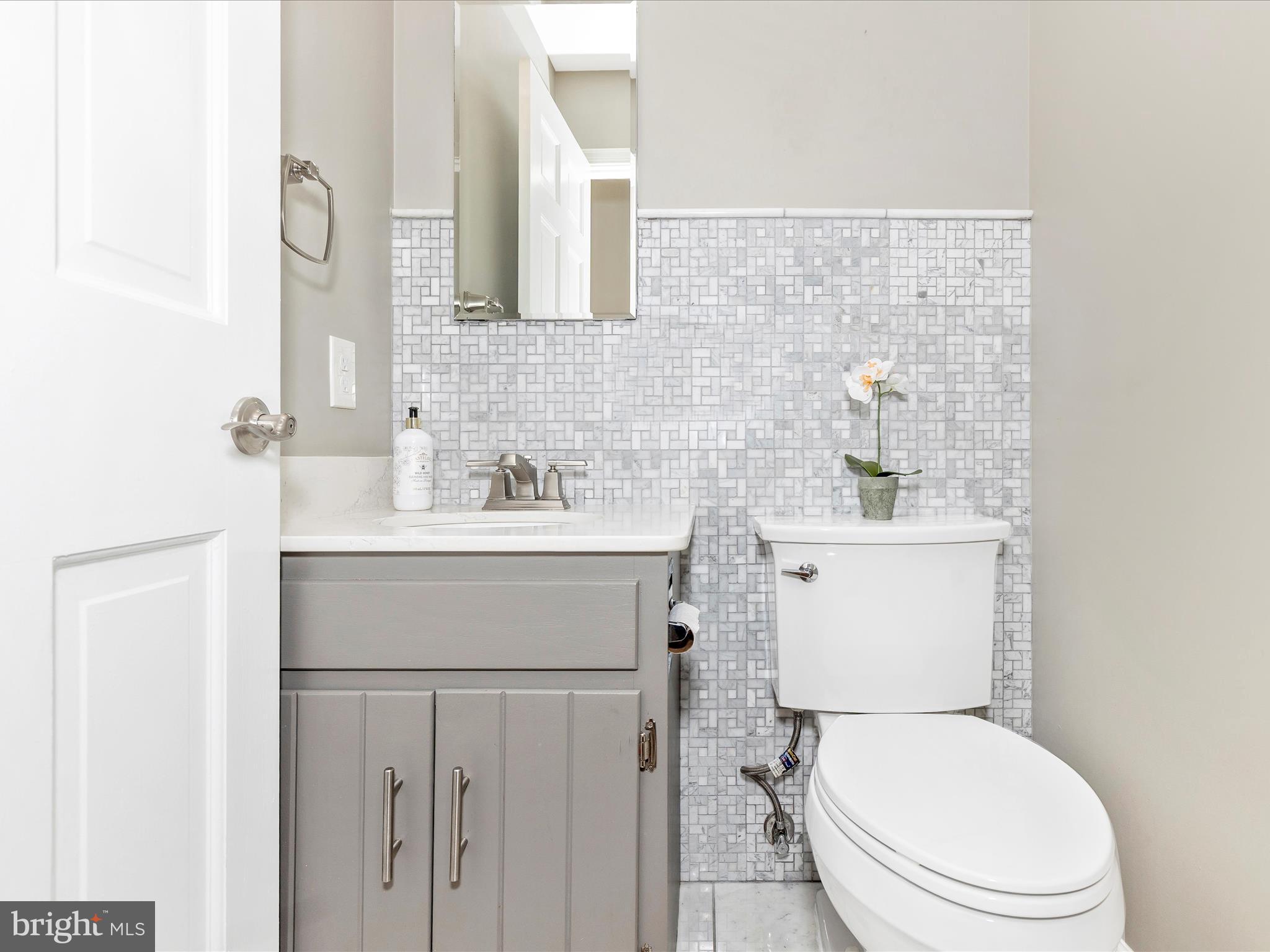 7094 Autumn Leaf Lane Frederick, MD 21702 - Photo 13 of 43 a bathroom with a sink toilet and mirror
