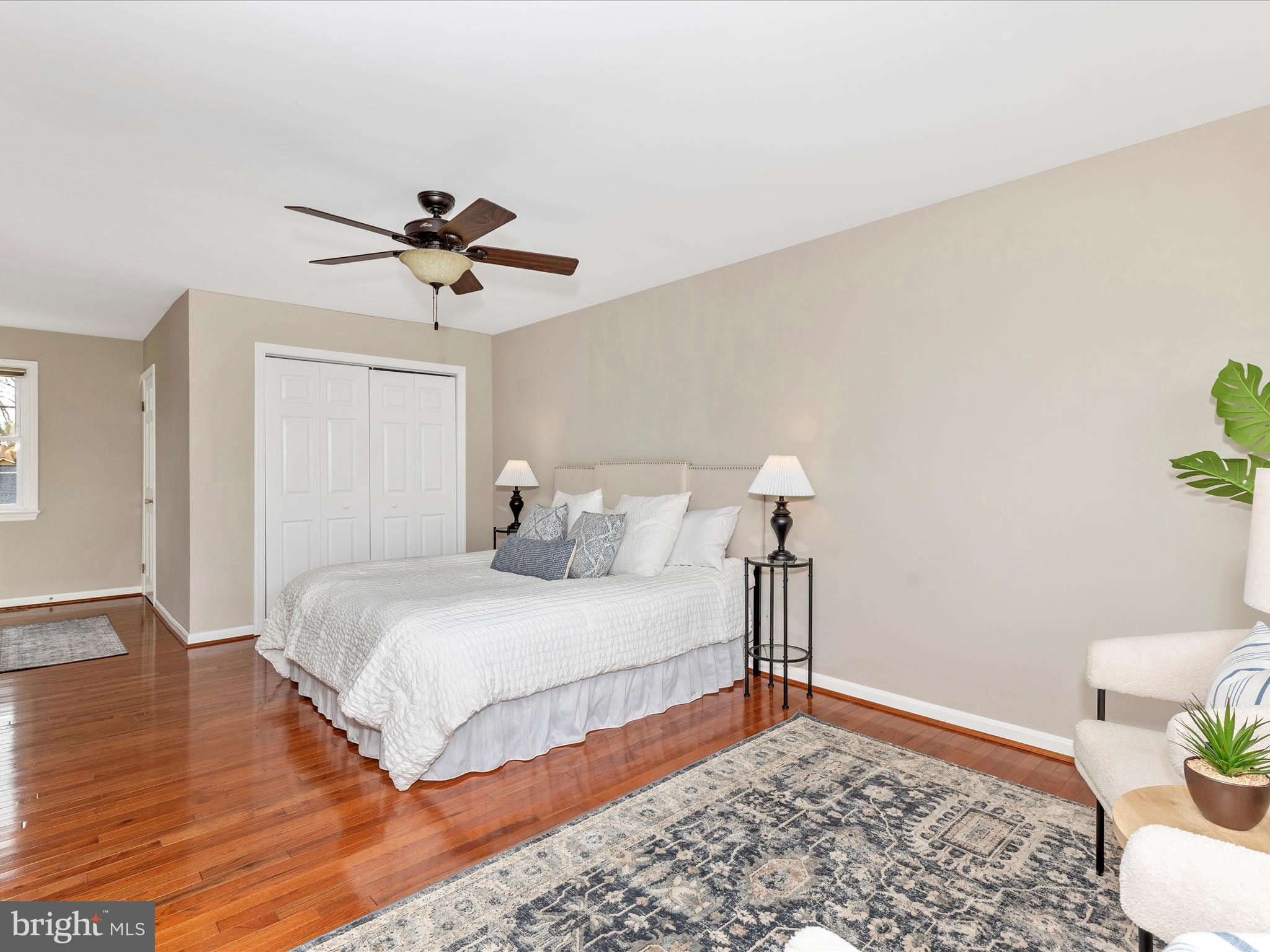 7094 Autumn Leaf Lane Frederick, MD 21702 - Photo 14 of 43 a bedroom with a bed and a lamp