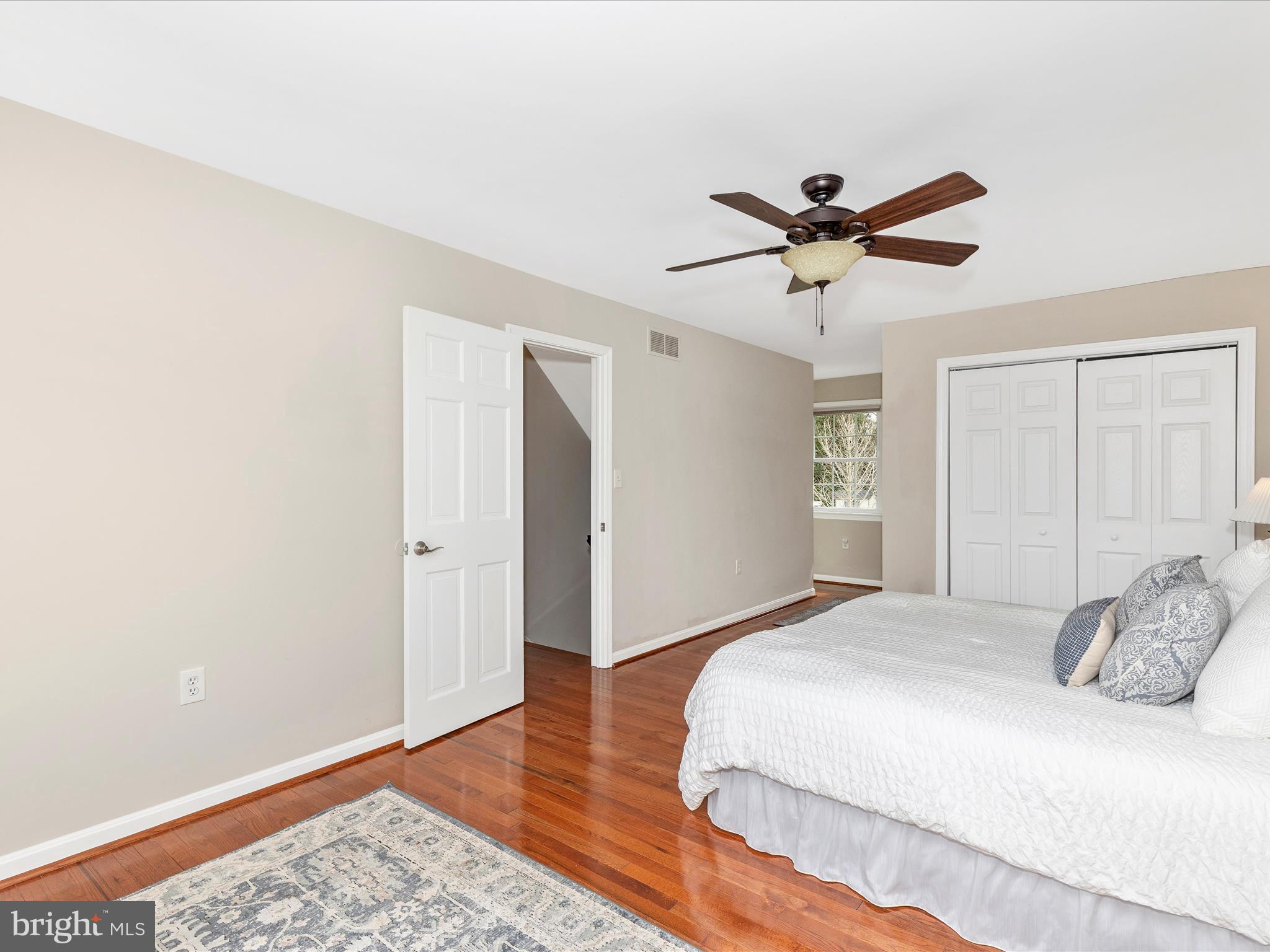 7094 Autumn Leaf Lane Frederick, MD 21702 - Photo 15 of 43 a bedroom with a bed and a ceiling fan