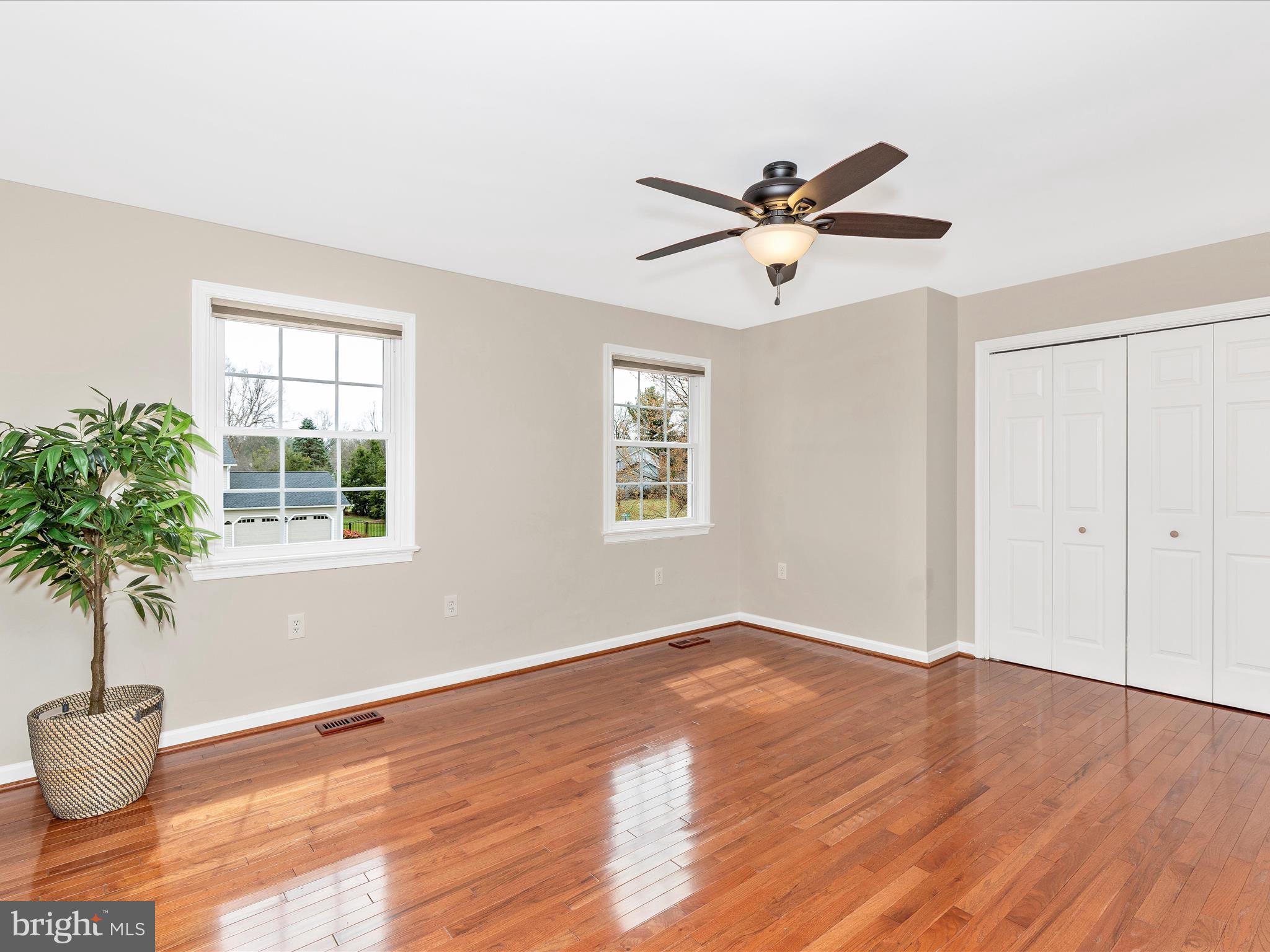 7094 Autumn Leaf Lane Frederick, MD 21702 - Photo 19 of 43 a view of empty room with wooden floor and window