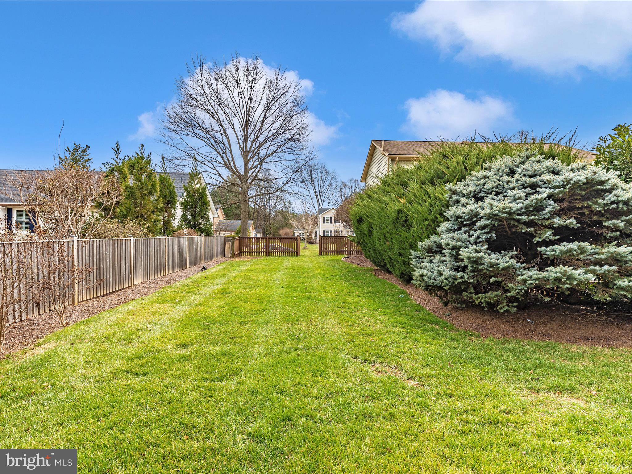 7094 Autumn Leaf Lane Frederick, MD 21702 - Photo 32 of 43 a view of a garden with wooden fence
