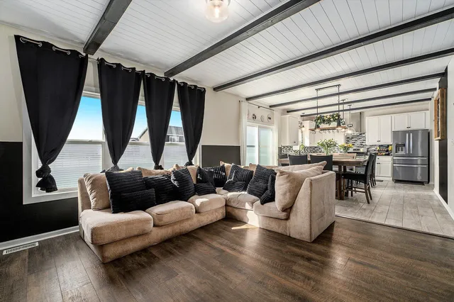 a living room with furniture and a large window