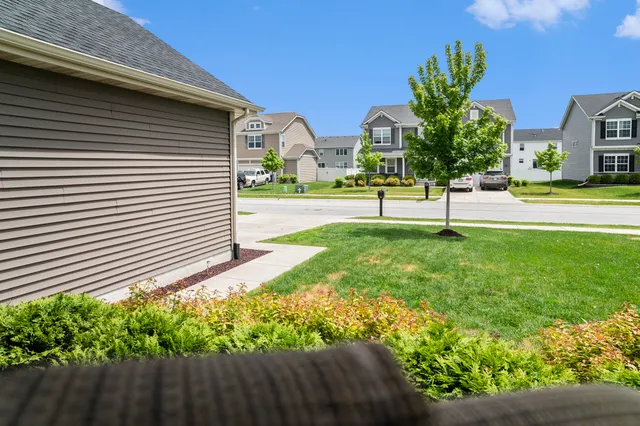 a view of house with backyard and garden