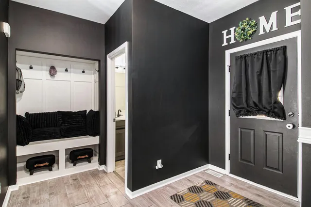 a bedroom with a bed and a fireplace