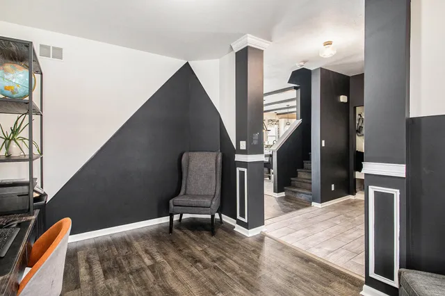 a view of entryway and hall with wooden floor