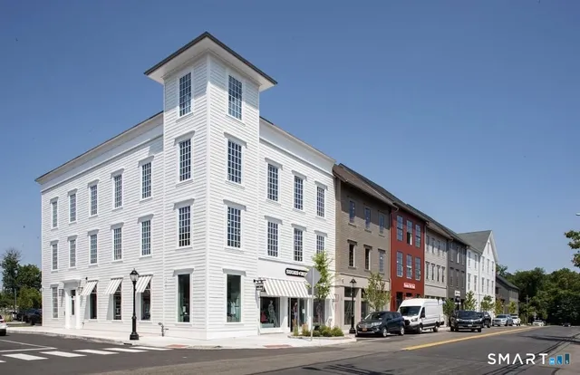 a front view of a building with a street
