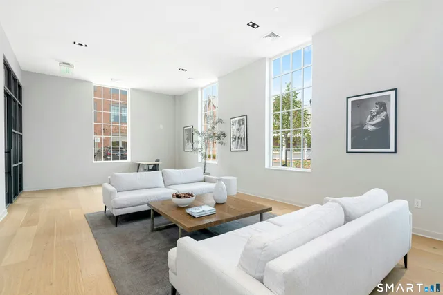 a living room with furniture and windows