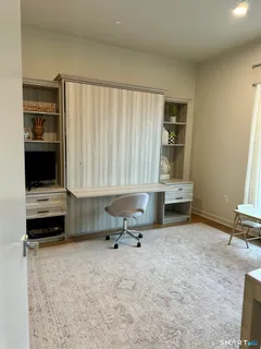 a room with furniture and a flat screen tv