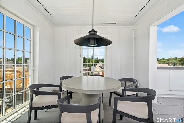 a dining room with furniture and window