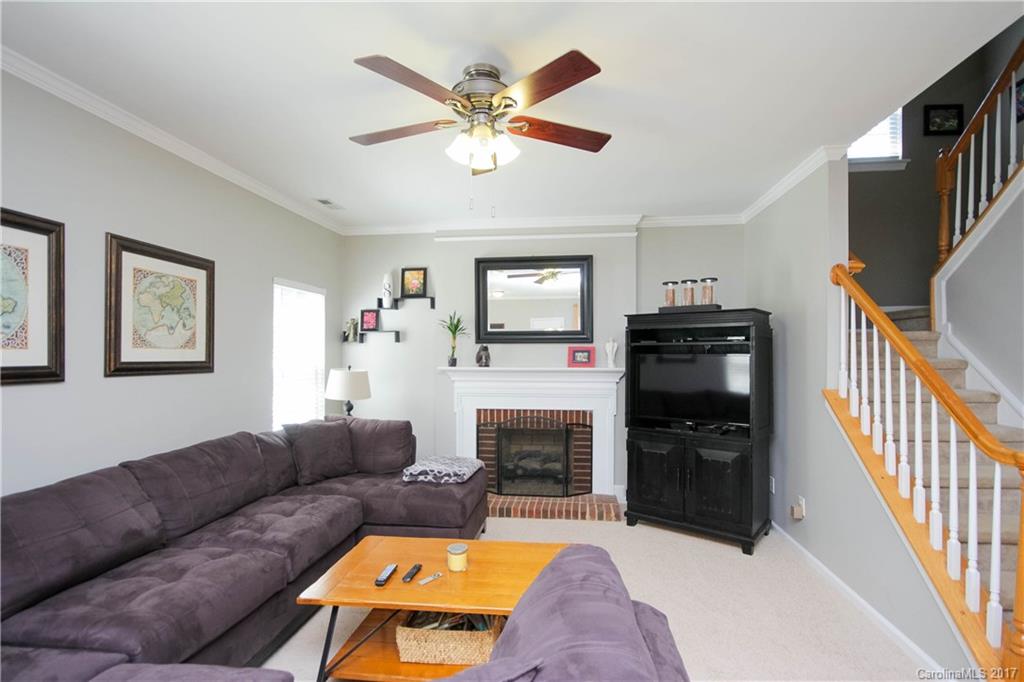 432 St George Road Fort Mill, SC 29708 - Photo 11 of 23 a living room with furniture a fireplace and a flat screen tv