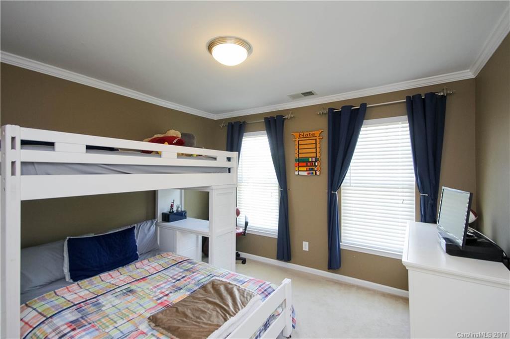 432 St George Road Fort Mill, SC 29708 - Photo 13 of 23 a bedroom with furniture and a fireplace