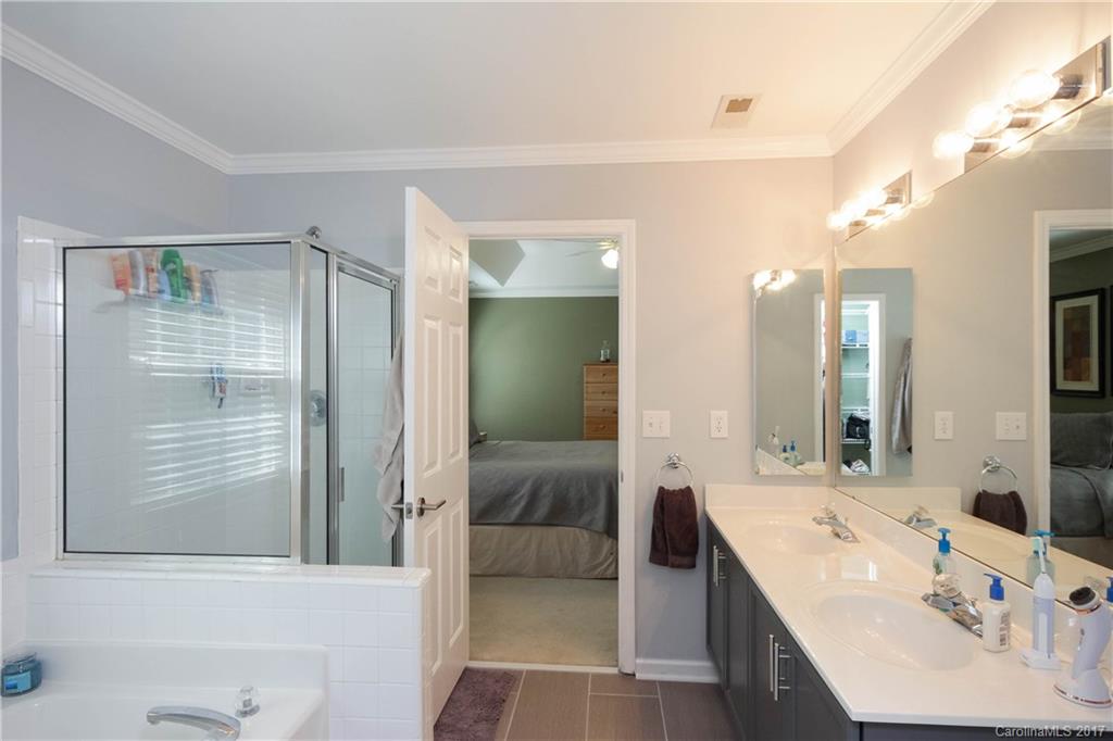 432 St George Road Fort Mill, SC 29708 - Photo 16 of 23 a en suite bathroom with a double vanity sink a mirror and a shower