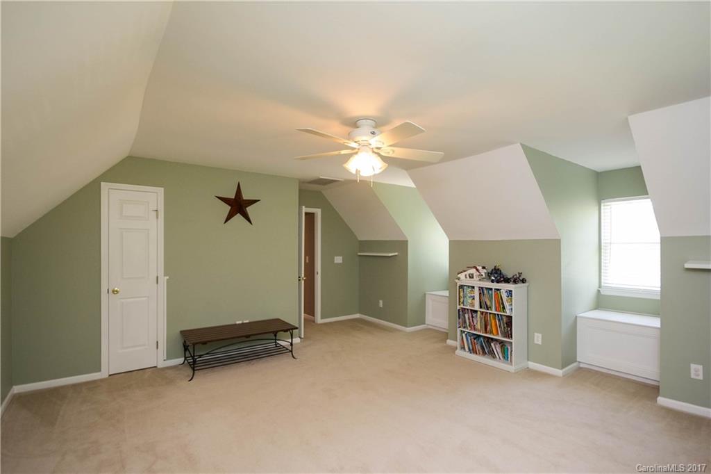 432 St George Road Fort Mill, SC 29708 - Photo 19 of 23 an empty room with windows and ceiling fan