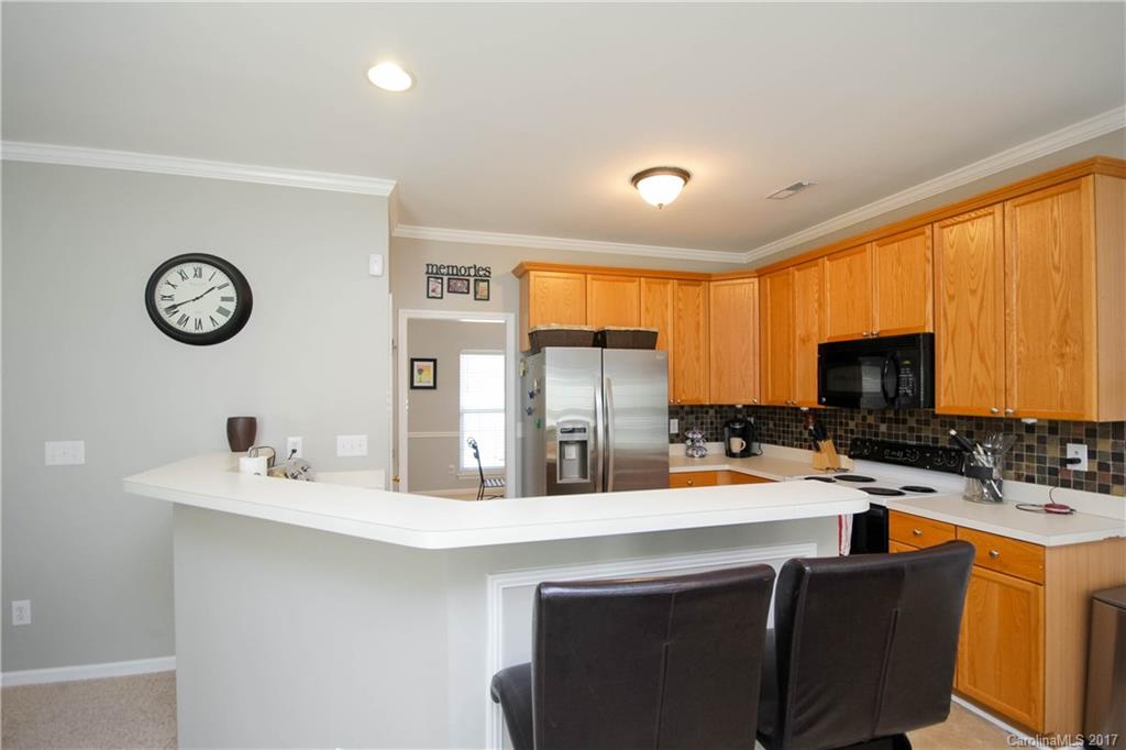432 St George Road Fort Mill, SC 29708 - Photo 8 of 23 a kitchen with stainless steel appliances a stove a sink a microwave a refrigerator and cabinets