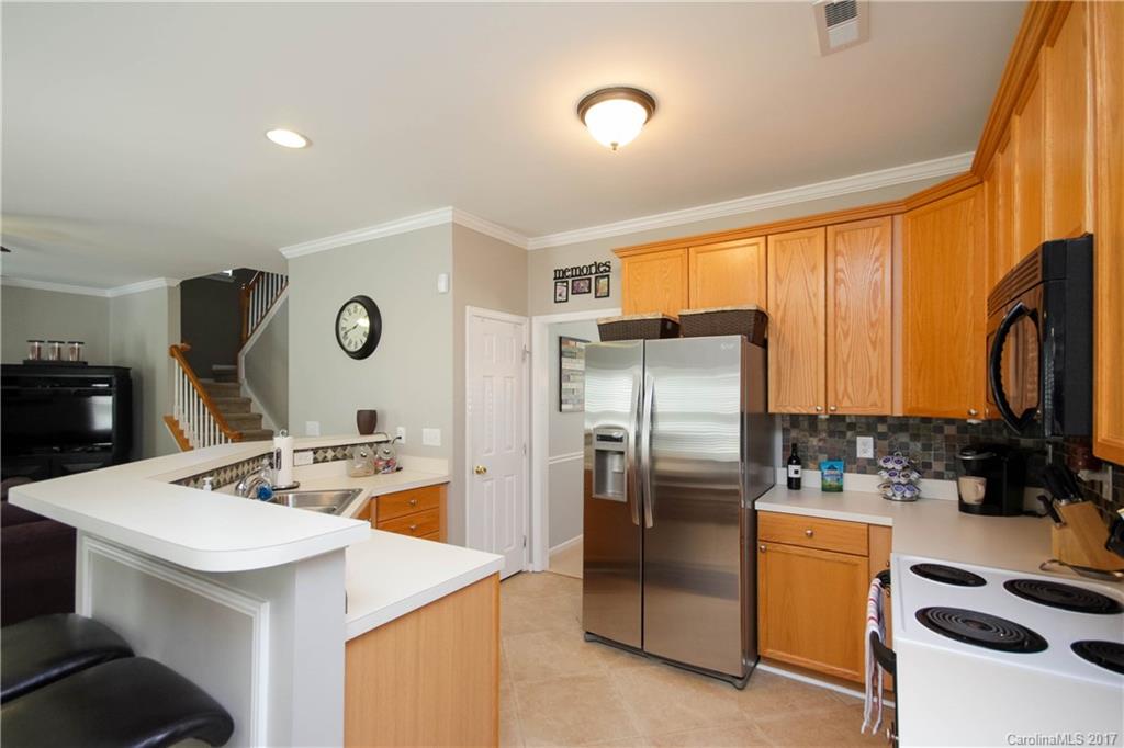 432 St George Road Fort Mill, SC 29708 - Photo 10 of 23 a kitchen with stainless steel appliances kitchen island a refrigerator sink and stove