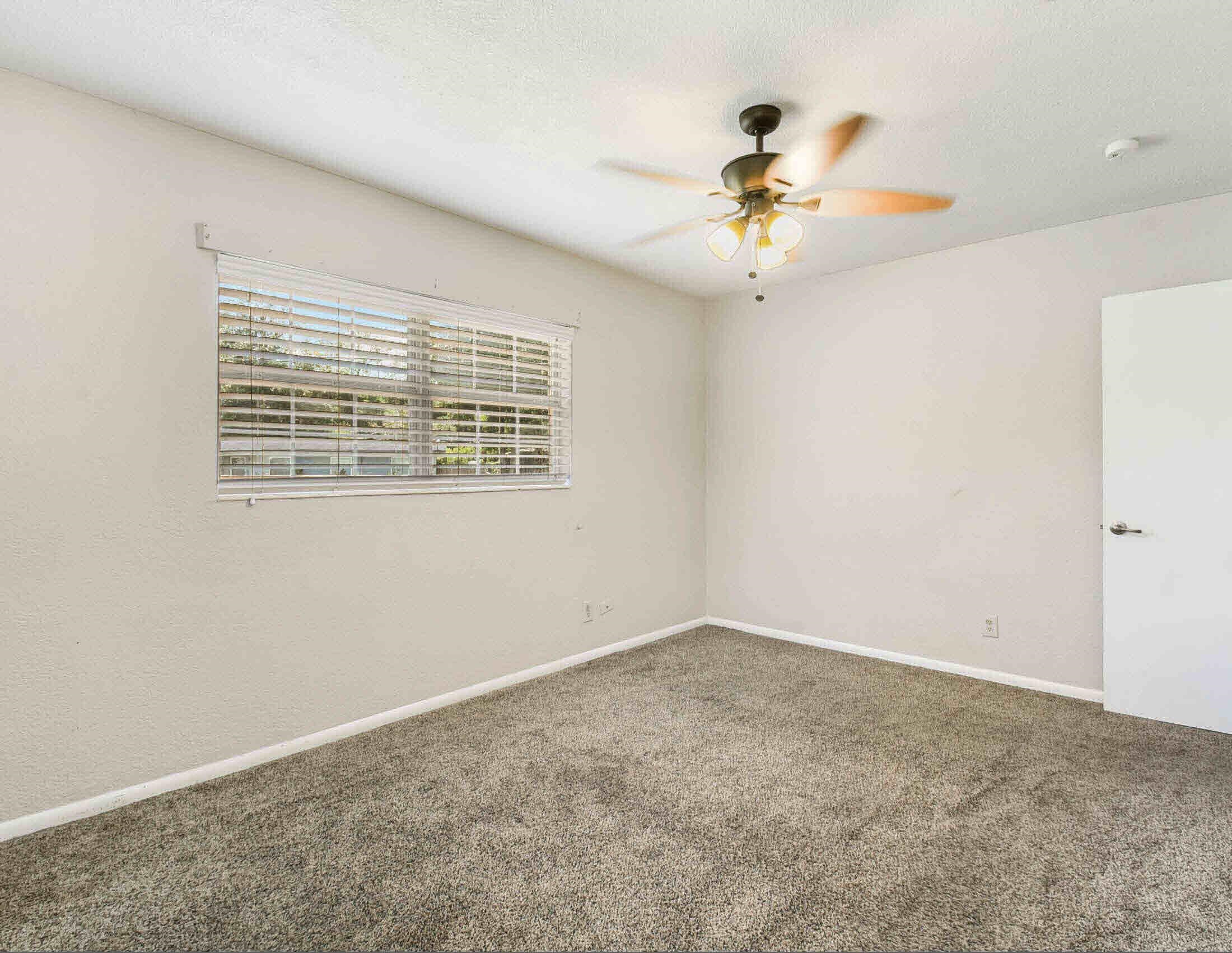 10403 Ebbitt Road Jacksonville, FL 32246 - Photo 12 of 22 a view of an empty room with a ceiling fan