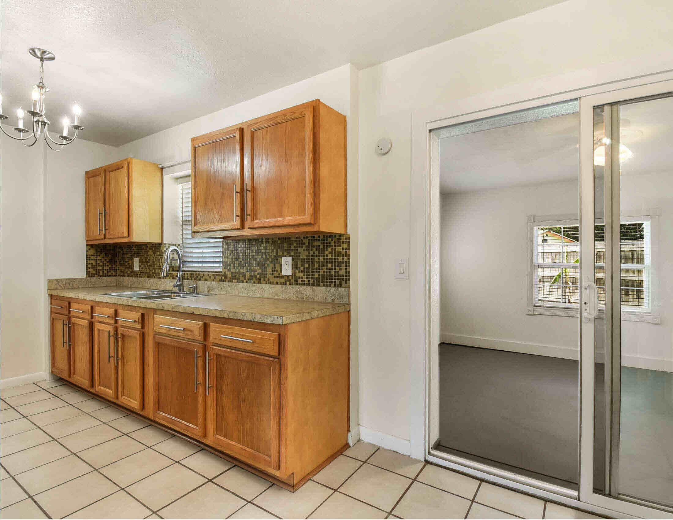 10403 Ebbitt Road Jacksonville, FL 32246 - Photo 16 of 22 a bathroom with a granite countertop sink and a mirror